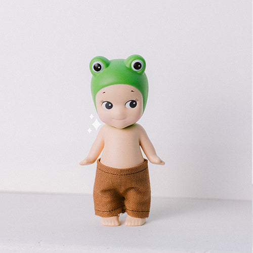 Sonny Angel Figurine wearing handmade brown pants. Sonny Angel clothes handmade to size. 