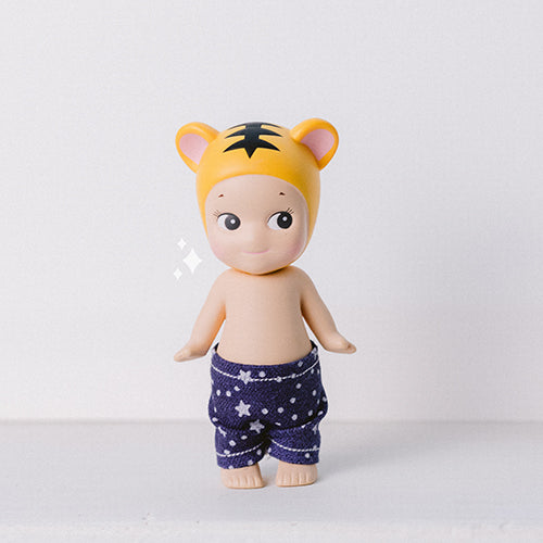 Sonny Angel Figurine wearing handmade jean pants that have white stars. Sonny Angel clothes handmade to size. 