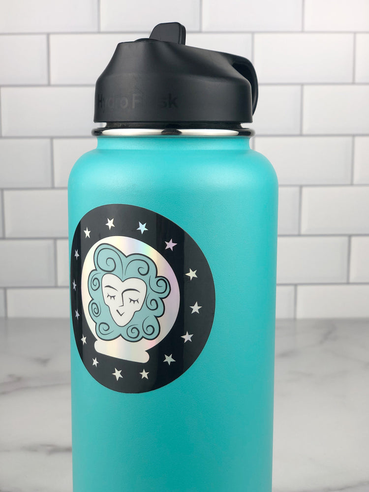 Madame Leota Sticker close up on a teal water bottle, showing the holographic aspect of the sticker